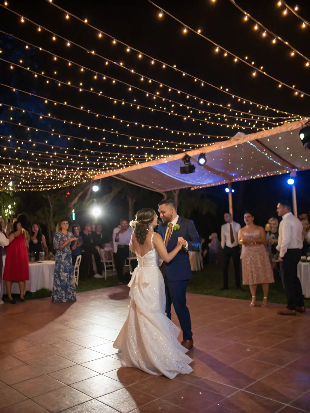 Photographer capturing a lively moment at a wedding reception with guests dancing, highlighting event coverage services.